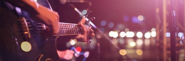 Guitarist on stage for background, soft and blur concept